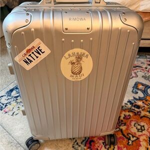 RIMOWA Silver Hard-Shell Carry-On with Travel Stickers (not real)